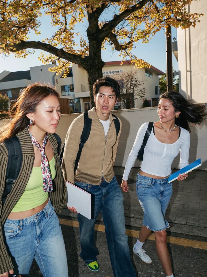 International students walking through a Korean campus in spring